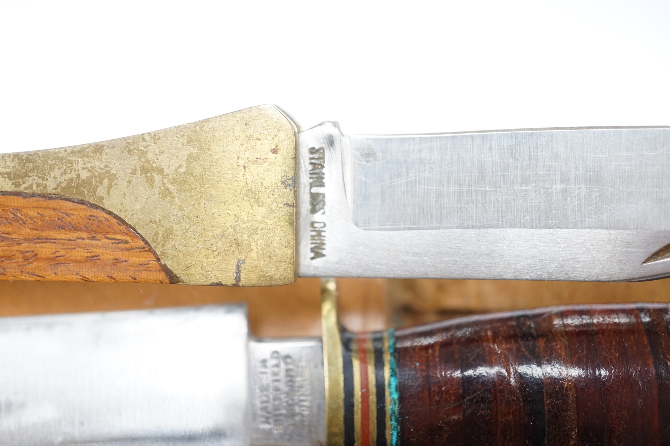 Two antler-handled hunting knives and three other knives